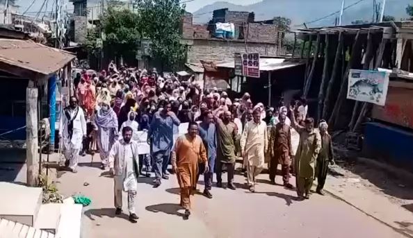 Protesters gather in Rawalakot, Pakistan-occupied Kashmir amid election protest and heavy security.